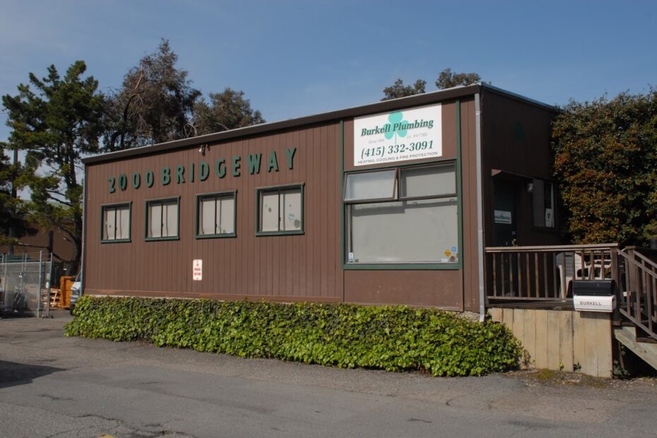 Exterior view of Burkell Plumbing Inc. in Sausalito, CA, featuring the main entrance, company sign, and building.