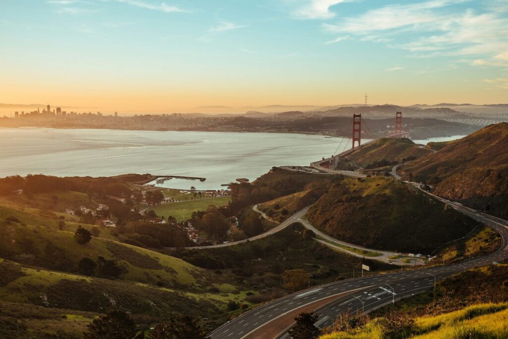 View from a Marin hillside overlooking the San Francisco Bay with the Golden Gate Bridge in the distance on a clear day.